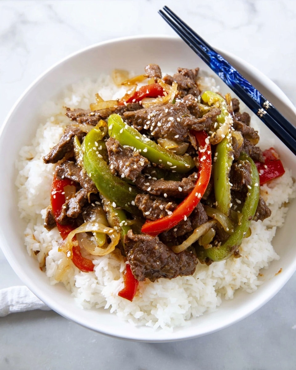 A white bowl filled with a base layer of fluffy white rice covering the bottom, topped with a mix of dark brown cooked beef strips, vibrant green and red sliced peppers, and light brown cooked onions. The beef and vegetables are scattered evenly in the center with a sprinkle of small white sesame seeds on top. The bowl is placed on a white marbled surface, with a pair of black and blue chopsticks resting on the rim. Photo taken with an iphone --ar 4:5 --v 7