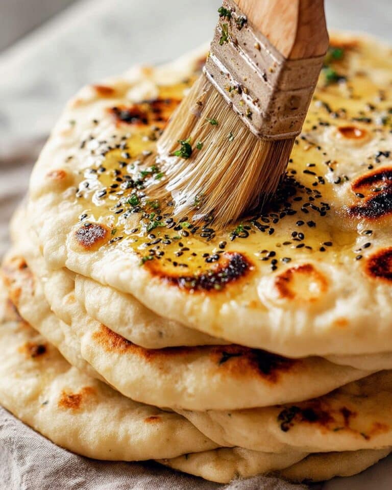 Fluffy Homemade Naan Bread with Garlic, Cheese, and Nigella Seeds Recipe