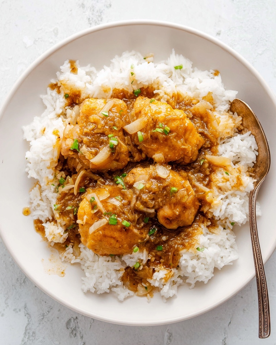 The image shows a close-up of three pieces of dark reddish-brown glazed chicken with a shiny, sticky texture, resting on a bed of white fluffy rice. The chicken pieces have a textured, slightly crispy surface with some small green herb sprinkles scattered on top. Bright green lime wedges are placed around the edges of the white plate, which sits on a white marbled surface. The overall look emphasizes the rich, saucy coating on the chicken contrasting with the soft white rice beneath. Photo taken with an iphone --ar 4:5 --v 7
