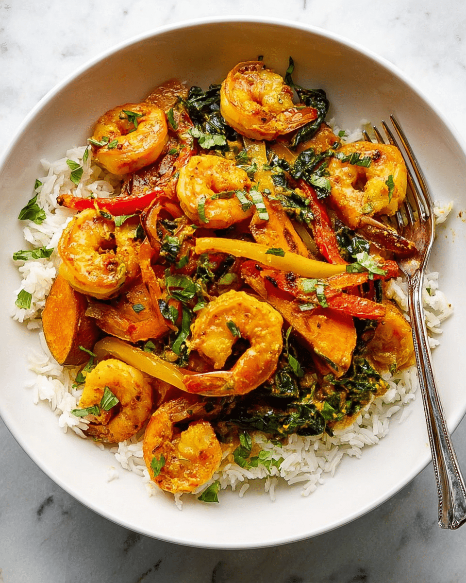 A white bowl filled with a base layer of fluffy white rice, topped with a colorful mix of cooked shrimp that are bright orange with a slight char, thin strips of yellow and red bell peppers, dark green leafy vegetables, and slices of golden-brown sweet potato. The dish is garnished with small green herb leaves scattered on top. A silver fork rests on the right side of the bowl, all placed on a white marbled surface. photo taken with an iphone --ar 4:5 --v 7